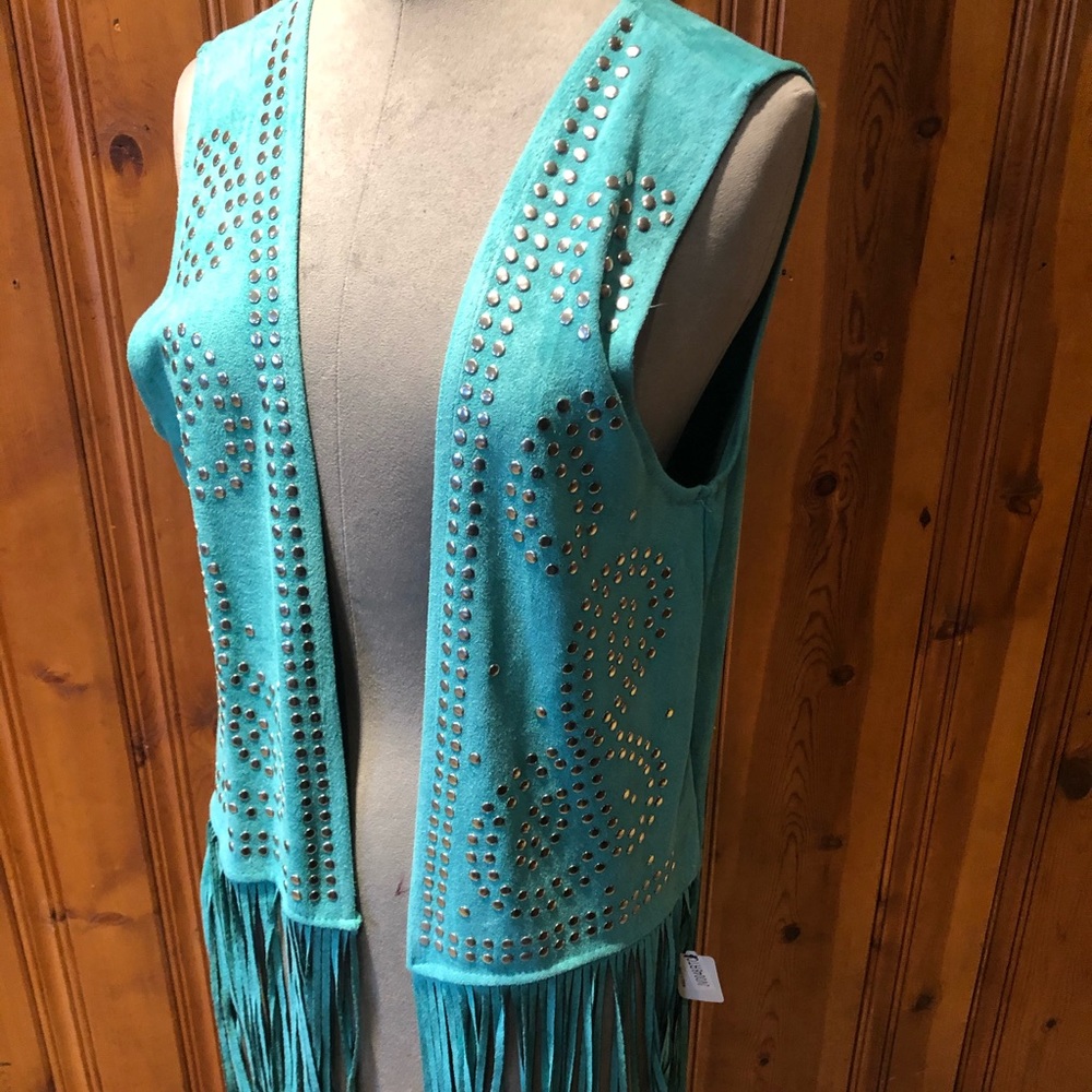 Fringe studded vest.